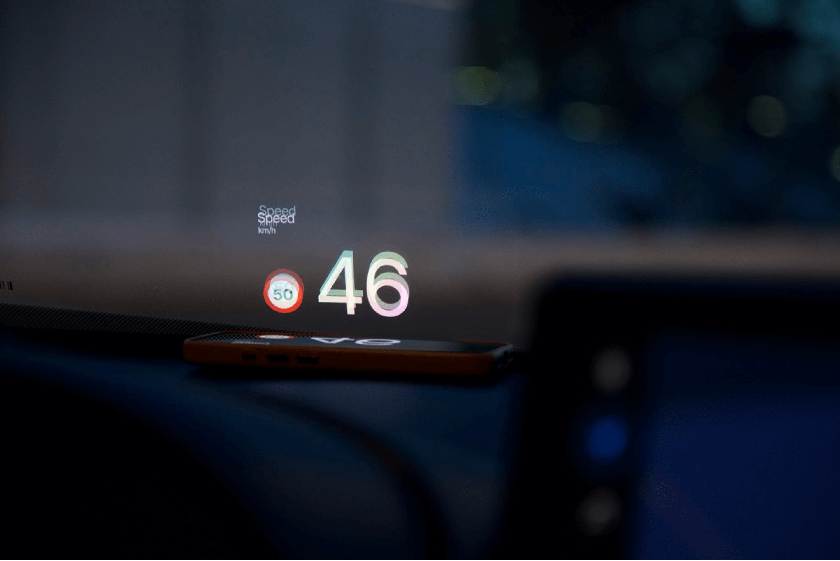 NordHUD display projected on car windshield during winter driving in snowy conditions